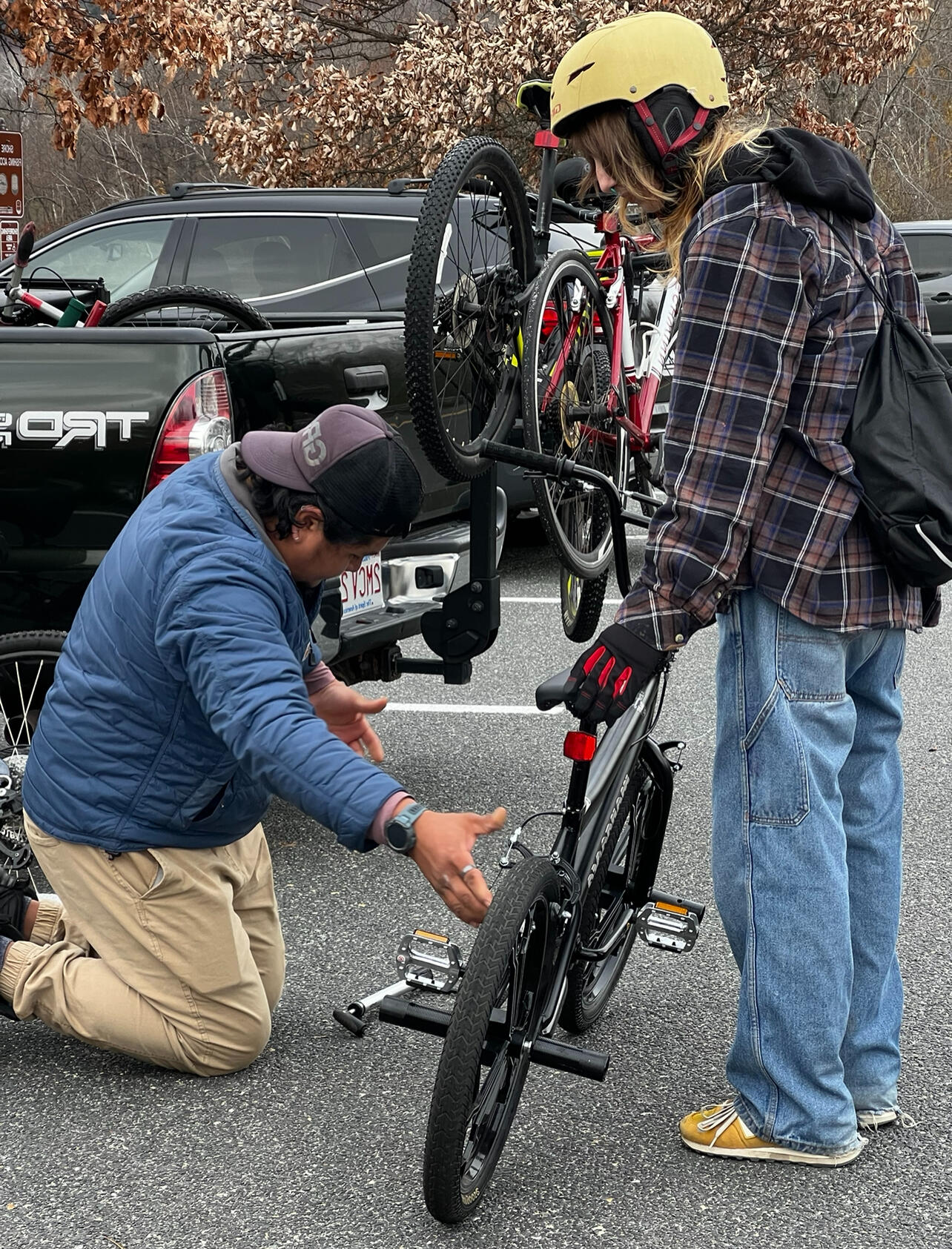 two Black men sit in nature discussing some of their prominent memories with nature together